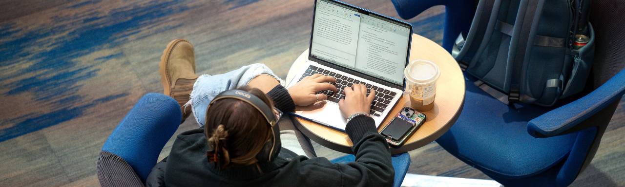 GVSU student studying on computer.